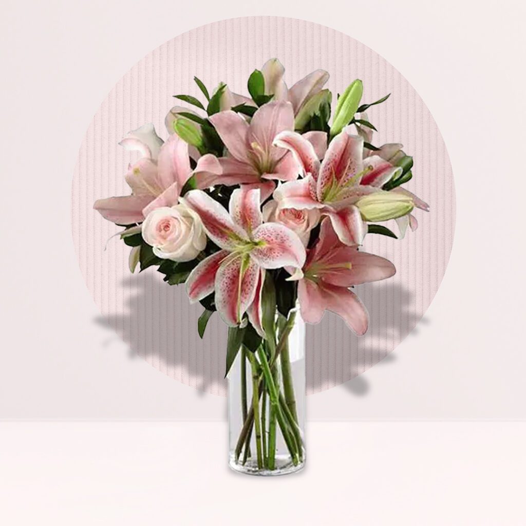 A floral bouquet of pink roses accented with wispy baby's breath.