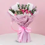A bouquet featuring vibrant pink roses