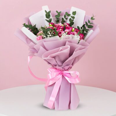 A bouquet featuring vibrant pink roses