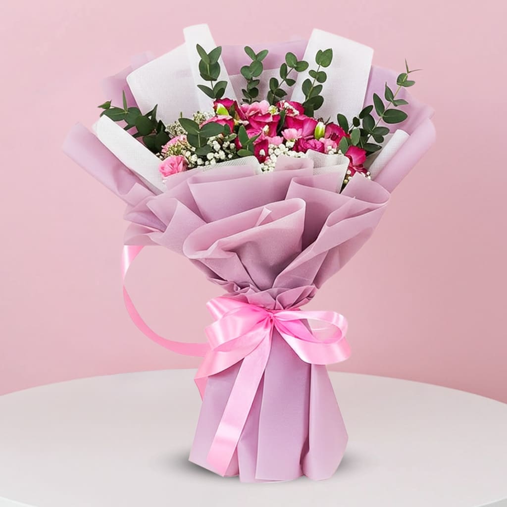 A bouquet featuring vibrant pink roses
