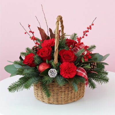 A decorative basket filled with vibrant red roses and natural pine cones, creating a festive wreath arrangement.