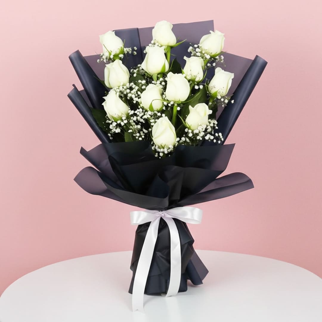 Designer Bouquet of 12 White Roses-03-25-01 A bouquet of white roses elegantly tied with a black ribbon, showcasing a classic and sophisticated floral arrangement.