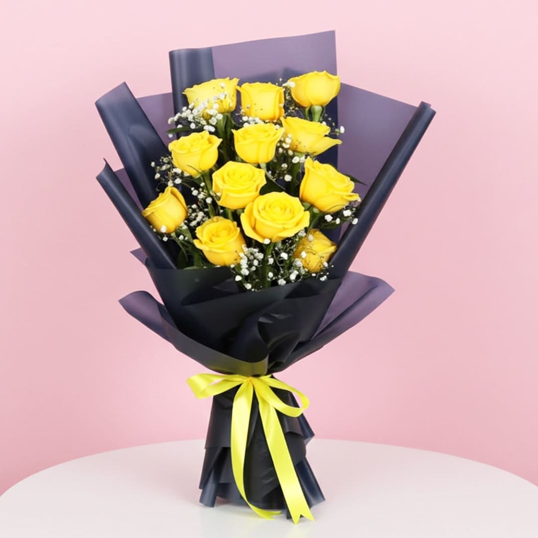 Designer Bouquet of 12 Yellow Roses-01-03-21 A bouquet of 12 vibrant yellow roses tied with a delicate yellow ribbon.