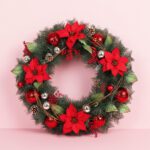 Fresh Christmas wreath adorned with poinsettias and red ornaments, set against a soft pink background.