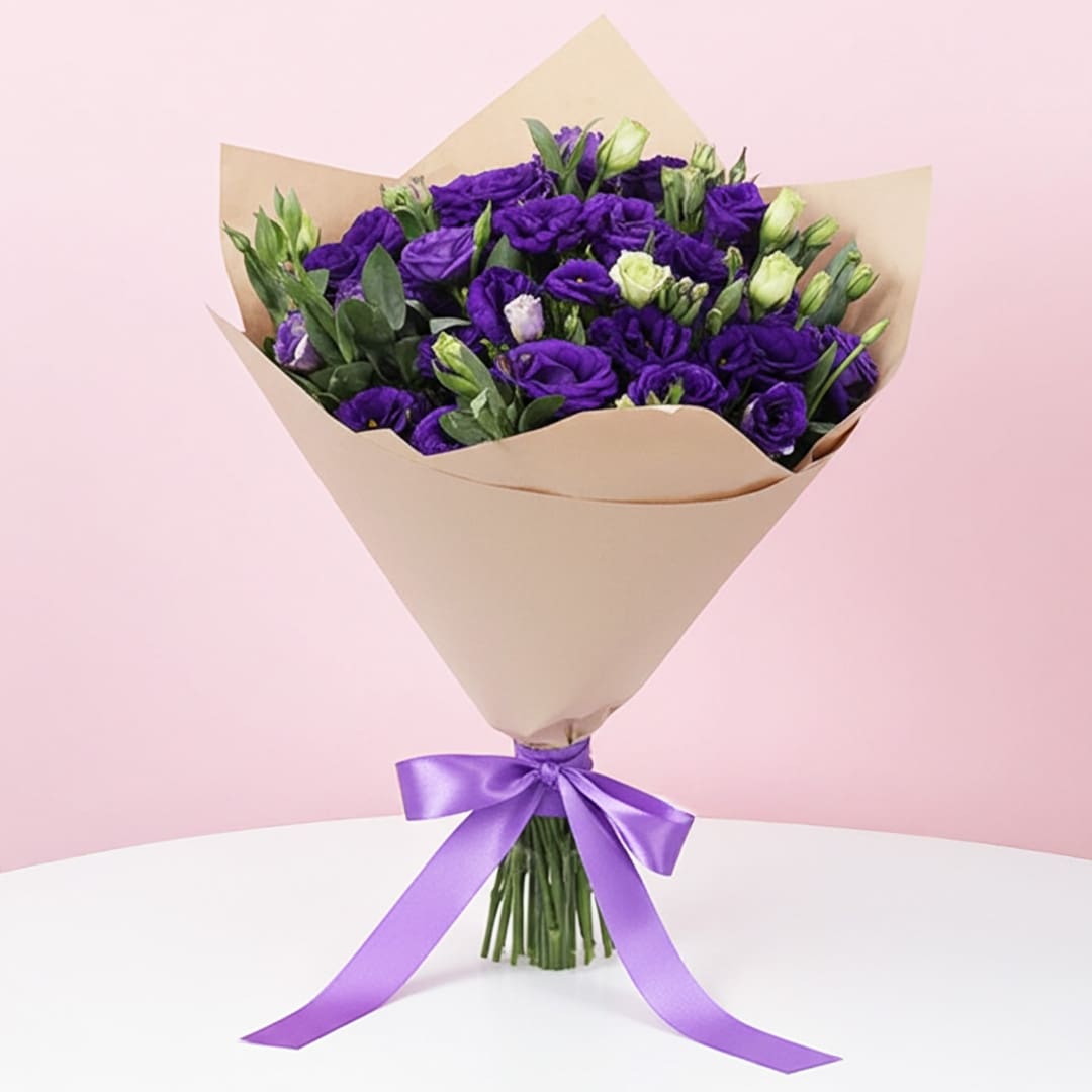 Purple Lisianthus Bouquet-01-04-12 A vibrant purple bouquet featuring purple roses and lisianthus, complemented by lush green leaves.