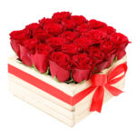Red Roses designed and arranged in a natural wooden box.