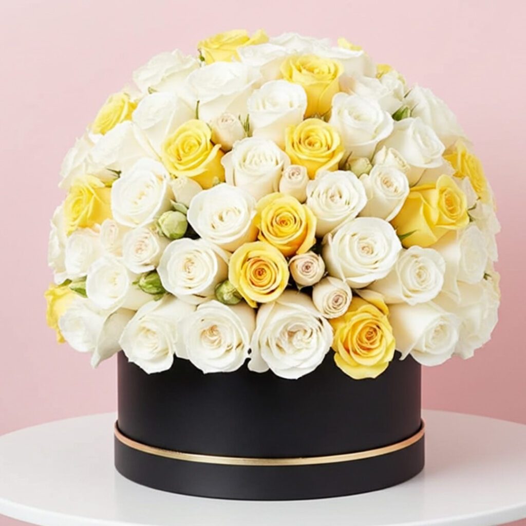 A large arrangement of red roses displayed in an elegant black box.