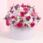 Floral arrangement showcasing 8 dark pink roses, 8 white spray roses, 5 light pink spray roses, and white hydrangeas.