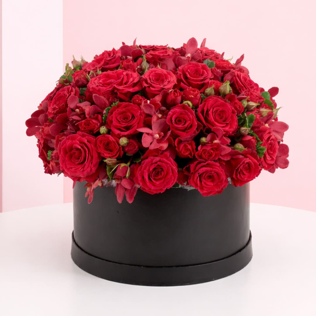 box-of-red-roses-2026 A large arrangement of red roses displayed in an elegant black box.