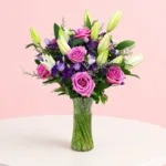 lavish-purple-roses-with-lily-in-vase_2026