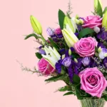 lavish-purple-roses-with-lily-in-vase_2026_02