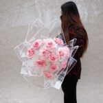 Dozen Pink Roses in White Wrap