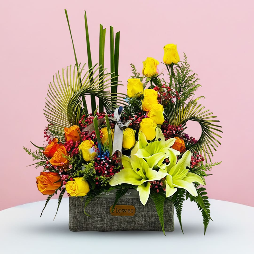 Star Of Festive-16-10 A vibrant flower arrangement displayed in a sleek gray box, showcasing a variety of colorful blooms.