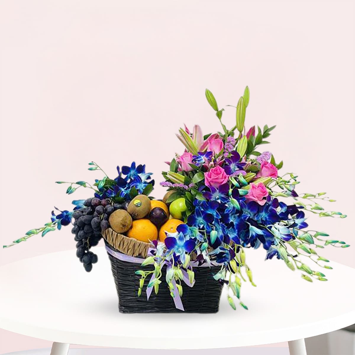 Fruits & Flower of Celebration-02-09-2025 A vibrant basket of assorted flowers rests on a table, adding a touch of nature to the setting.
