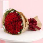 A beautiful bouquet featuring 50 red roses, a classic symbol of love and romance, ideal for special occasions.