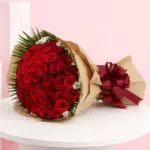 A beautiful bouquet featuring 50 red roses, a classic symbol of love and romance, ideal for special occasions.