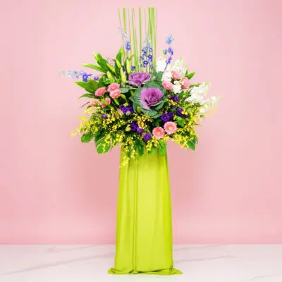 The Purple Flowers And Green Leaves, Complemented By Seasonal Greenery And Diverse Flower Stems For The Occasion.