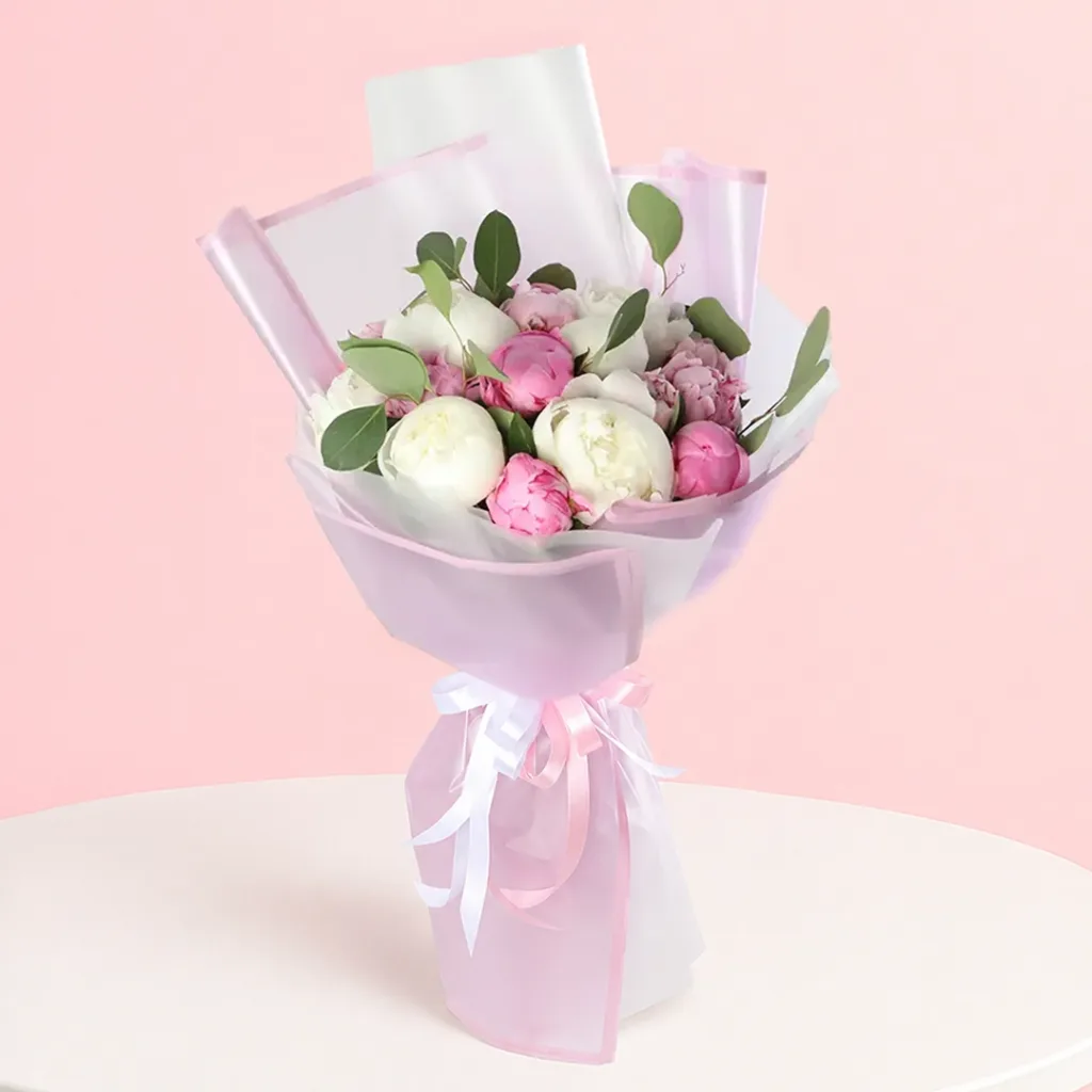 A bouquet of delicate peonies, showcasing their beauty and elegance, symbolizing the development of relationships.