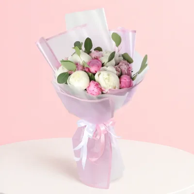 A bouquet of delicate peonies, showcasing their beauty and elegance, symbolizing the development of relationships.