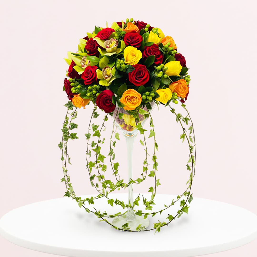 Elegant Long-Stemmed Roses Glass Vase-14-10 A vibrant bouquet of assorted flowers arranged in a clear glass vase.
