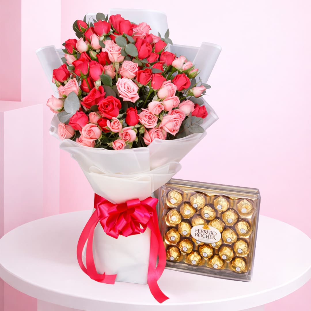 sweetheart-ferrero-rose-surprise-2026 A romantic arrangement of roses and Ferrero chocolates on a table, named Sweetheart’s Ferrero Rose Surprise.