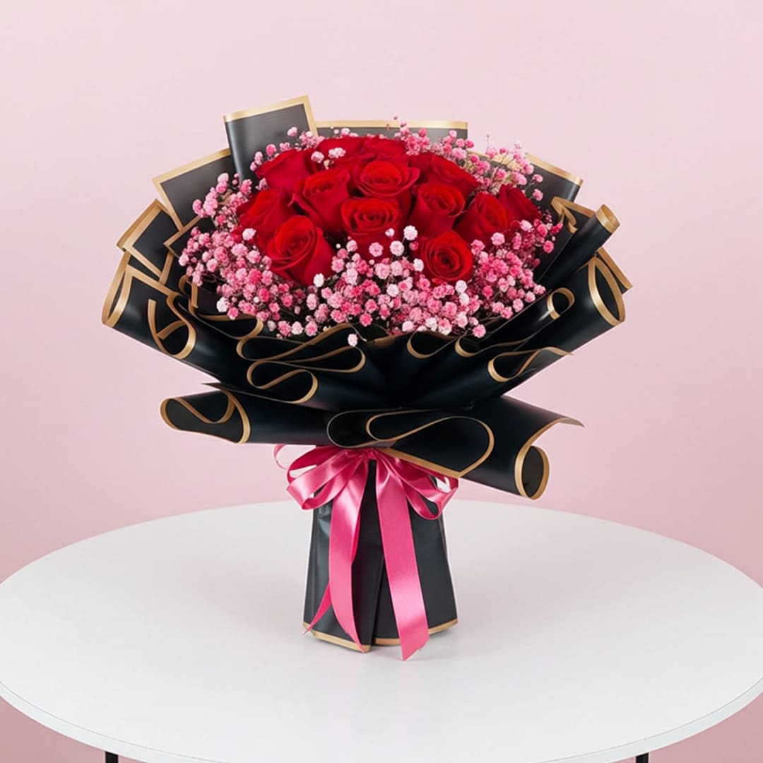 Velvet Rose Bouquet-01 A vibrant bouquet featuring red roses and delicate pink flowers arranged together.