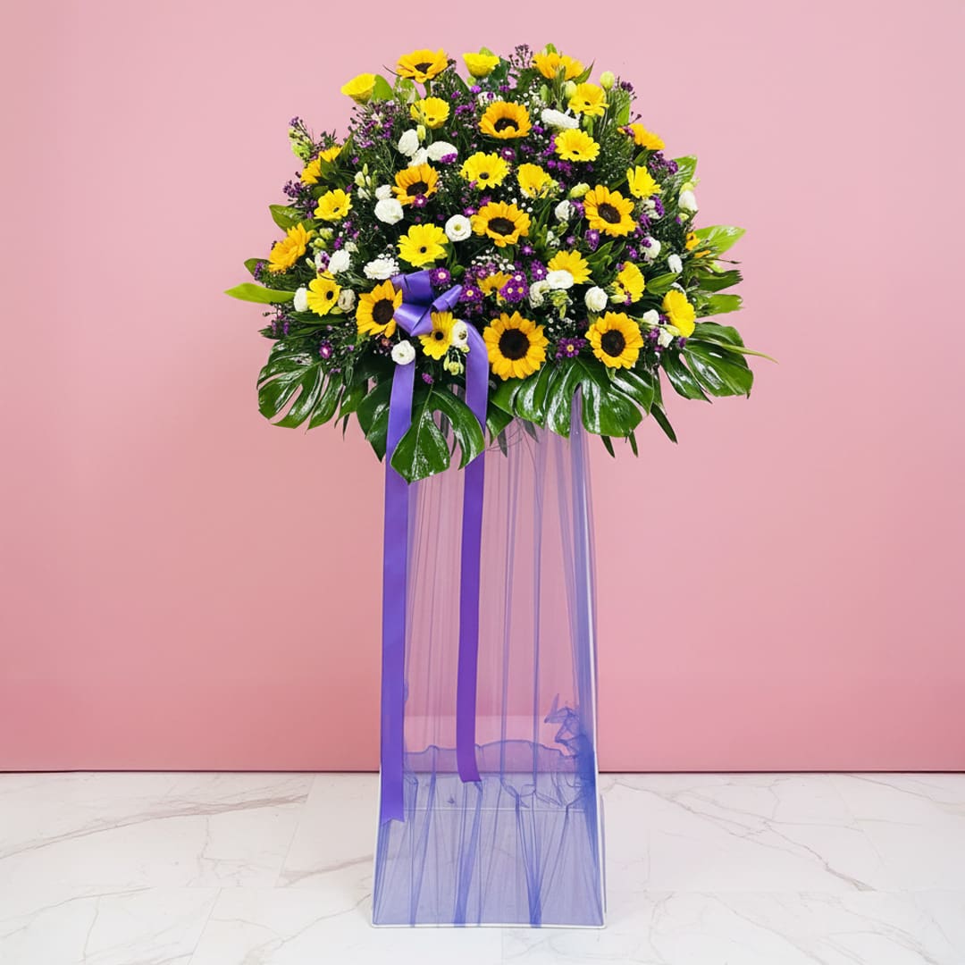 sunflower-serenade-stand-25 A Vibrant Display Of Sunflowers And Purple Flowers, Celebrating Joy At A Grand Opening Event.