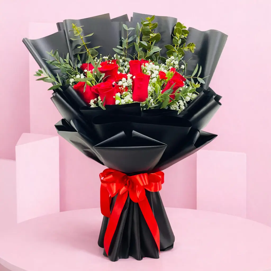A beautiful bouquet of red roses alongside elegant white blooms.