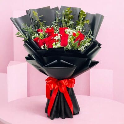 A beautiful bouquet of red roses alongside elegant white blooms.