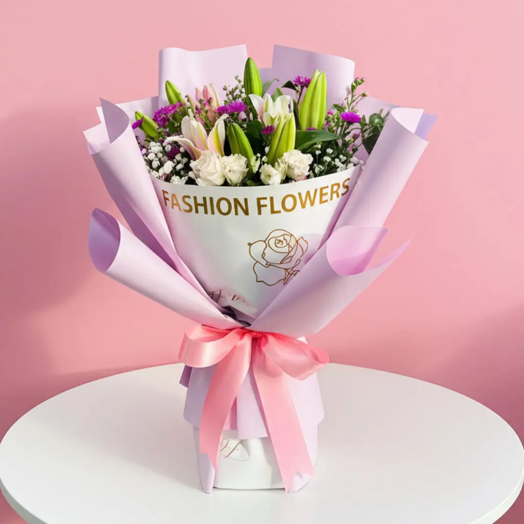 A vibrant bouquet of lilies featuring the phrase "Fashion Flowers" artistically integrated into the arrangement.