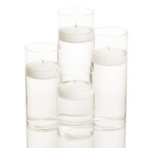 Four cylindrical glass vases filled with water and floating candles. The vases are arranged in different sizes, with the largest one in the back and the smallest one in the front.