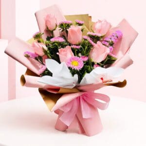 A bouquet of pink and purple roses arranged in a brown paper bag, showcasing soft elegance and charm.