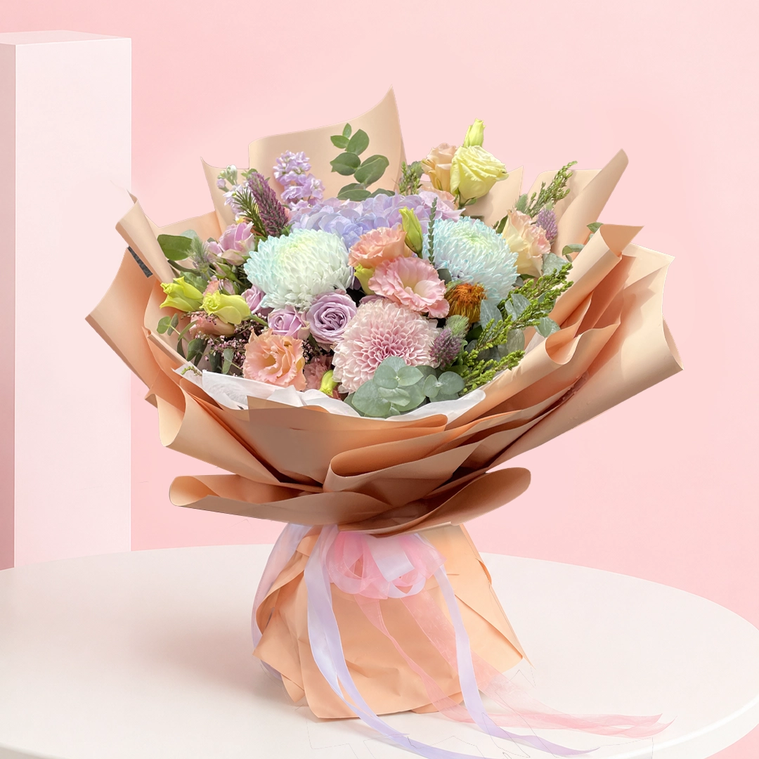 whimsical-blossom-wonderland_2026 A colorful bouquet of flowers arranged in a paper bag, placed on a wooden table.