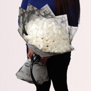 A timeless classic, a bouquet of pure white roses.