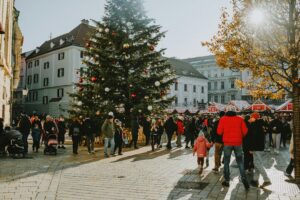 A Christmas tree stands prominently in the center, adorned with ornaments and lights.