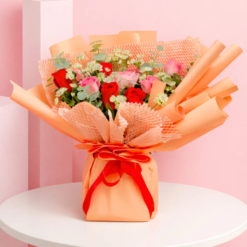 A charming bouquet of peach roses presented in a stylish