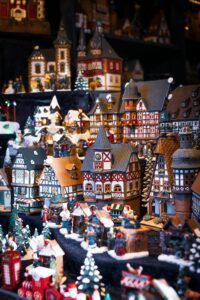A miniature Christmas village scene with intricate details and festive decorations