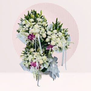 Three Floral Arrangements: The image features three distinct floral arrangements, each presented individually but grouped together for the shot.
