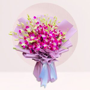 close-up of a bouquet of purple and white orchids, wrapped in light pink paper