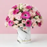 Pink gerbera and rose arrangement in a marble box