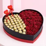 Red roses Ferrero heart box with chocolates in a heart-shaped box arrangement,