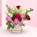 Bouquet of fresh multi colour roses arranged together, featuring a vibrant mix of shades for a lively and cheerful floral display