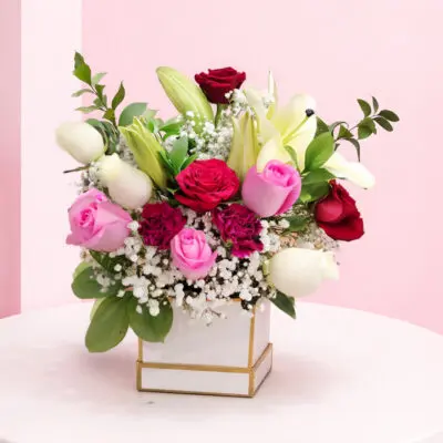 Bouquet of fresh multi colour roses arranged together, featuring a vibrant mix of shades for a lively and cheerful floral display