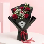 Best Dad Ever Bouquet featuring fresh red roses, baby’s breath, and ruscus leaves arranged in an elegant floral design for Father's Day and appreciation gifting.