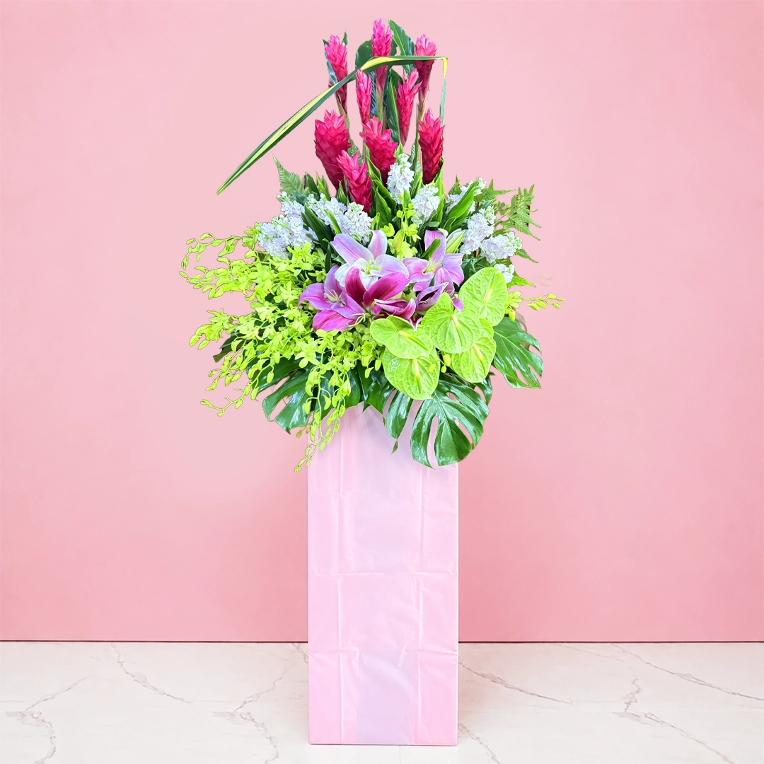 pink-prosperity-opening-stand Grand Opening flower stand with pink lilies, red ginger flowers, anthurium and tropical foliage