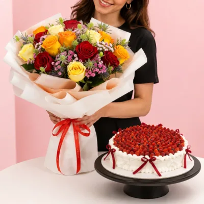 Rose Bouquet Velvet Cake Combo featuring a hand bouquet of 15 assorted roses with greenery paired with a Black Forest cake made with chocolate chiffon, fresh cream, and dark sweet cherries.