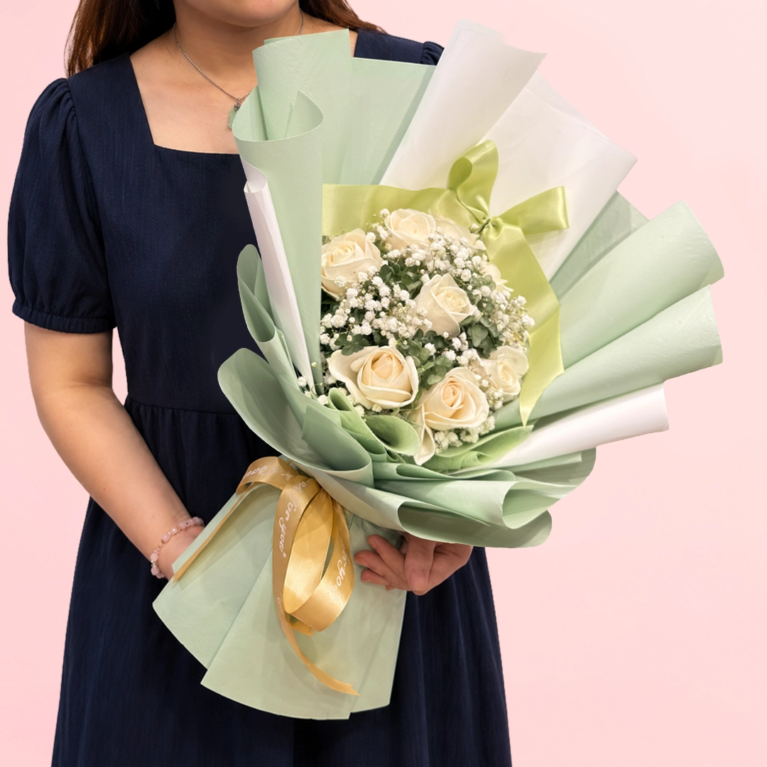 signature-rose-bouquet Signature White Rose Bouquet featuring fresh white roses and delicate gypsophila arranged in an elegant and timeless floral design.