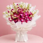 15 royal purple orchids with green accents wrapped in a white sheet.