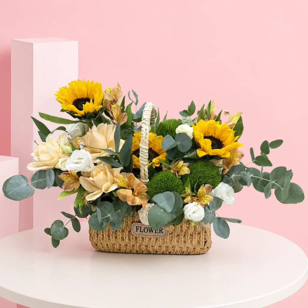 Premium flower basket featuring 3 sunflowers, 3 roses, 3 lisianthus stems, green trick flowers, fresh seasonal fillers, and lush foliage.