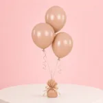 Peach party balloons arranged as a trio for special occasions.